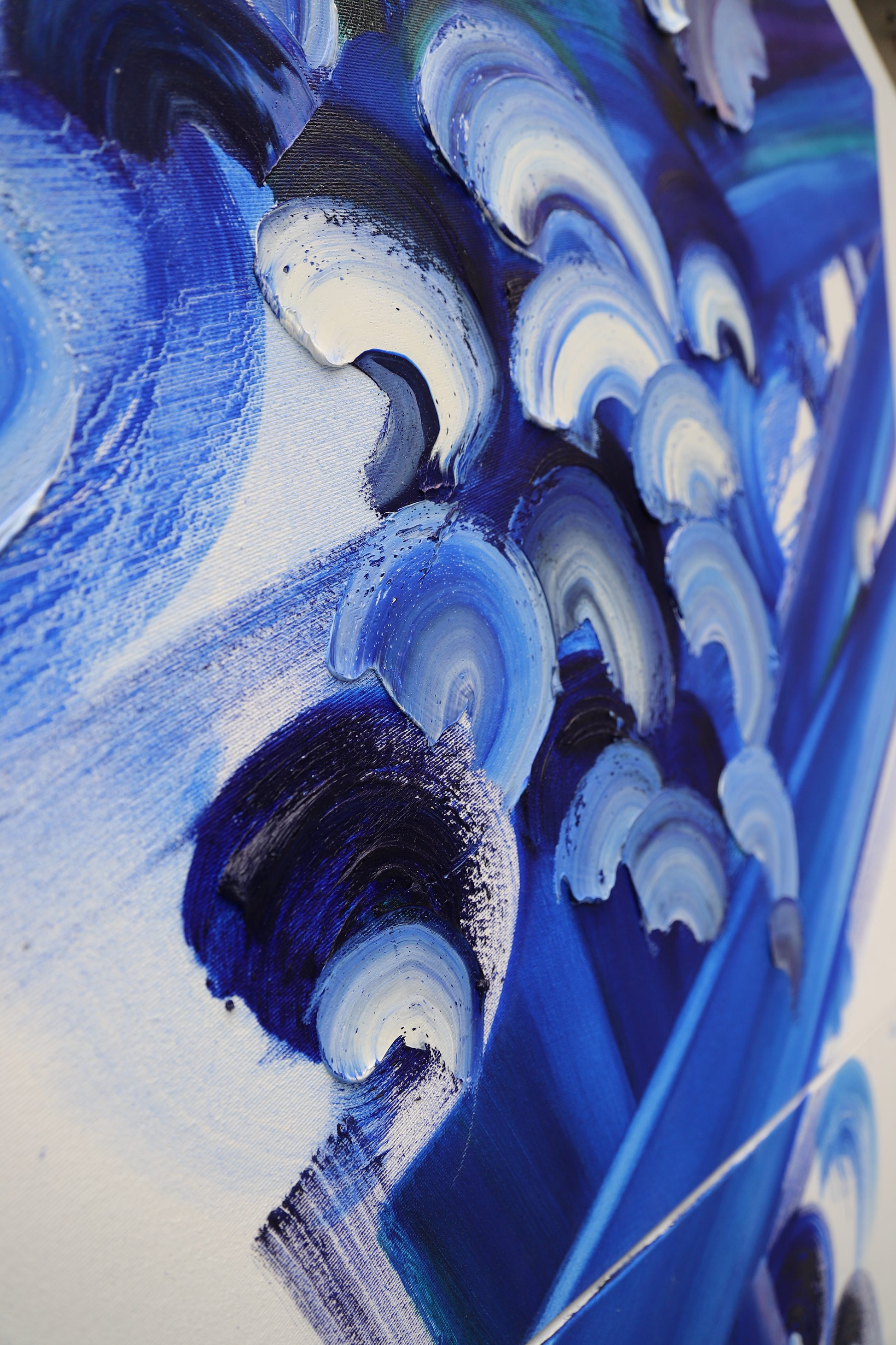 Close-up of a blue and white abstract painting