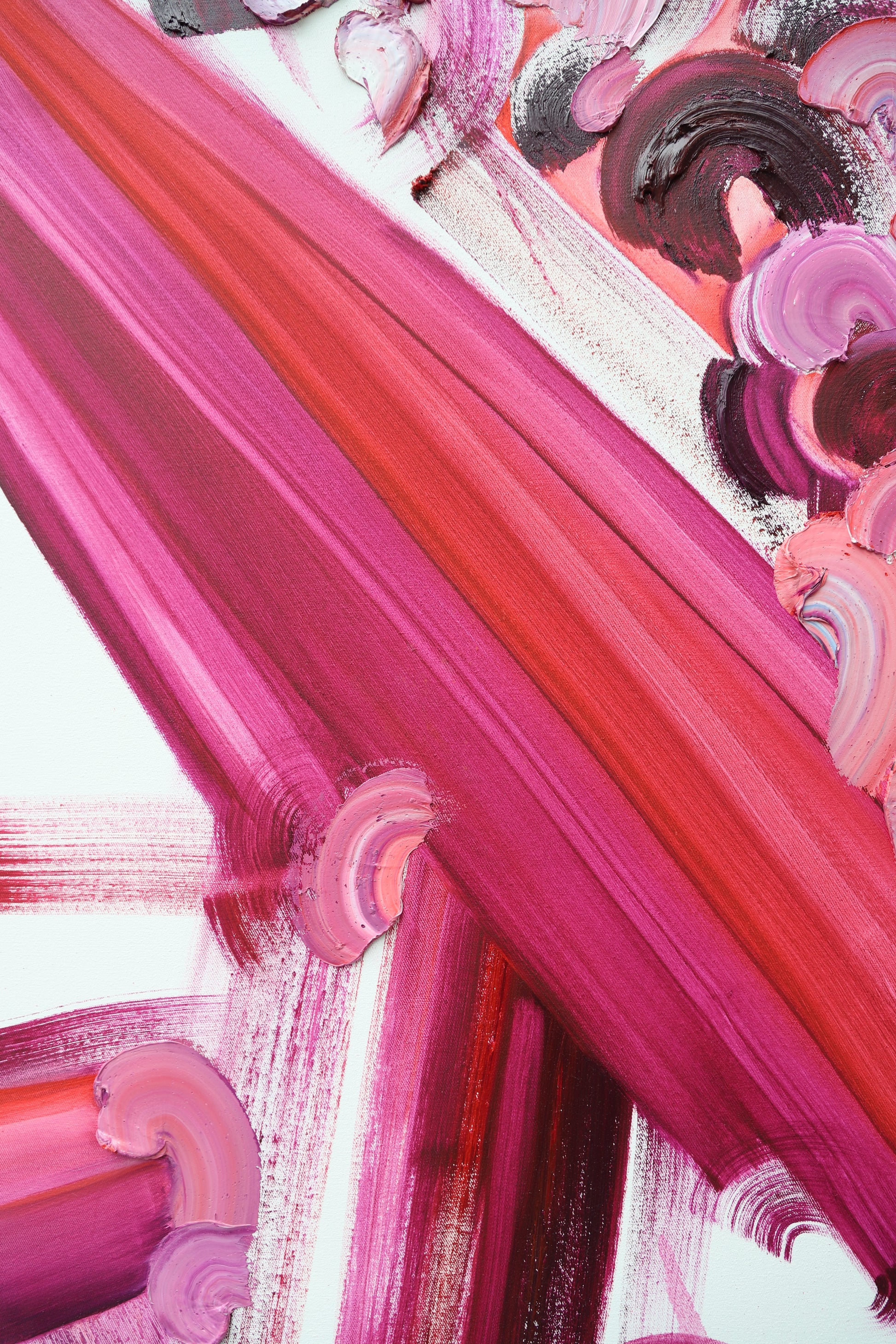 Close-up of pink and purple abstract art with brush strokes